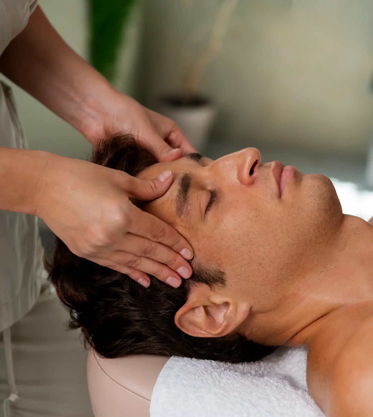 Indian man enjoying a relaxing head massage during his Indian Head Massage experience at Pause Spa